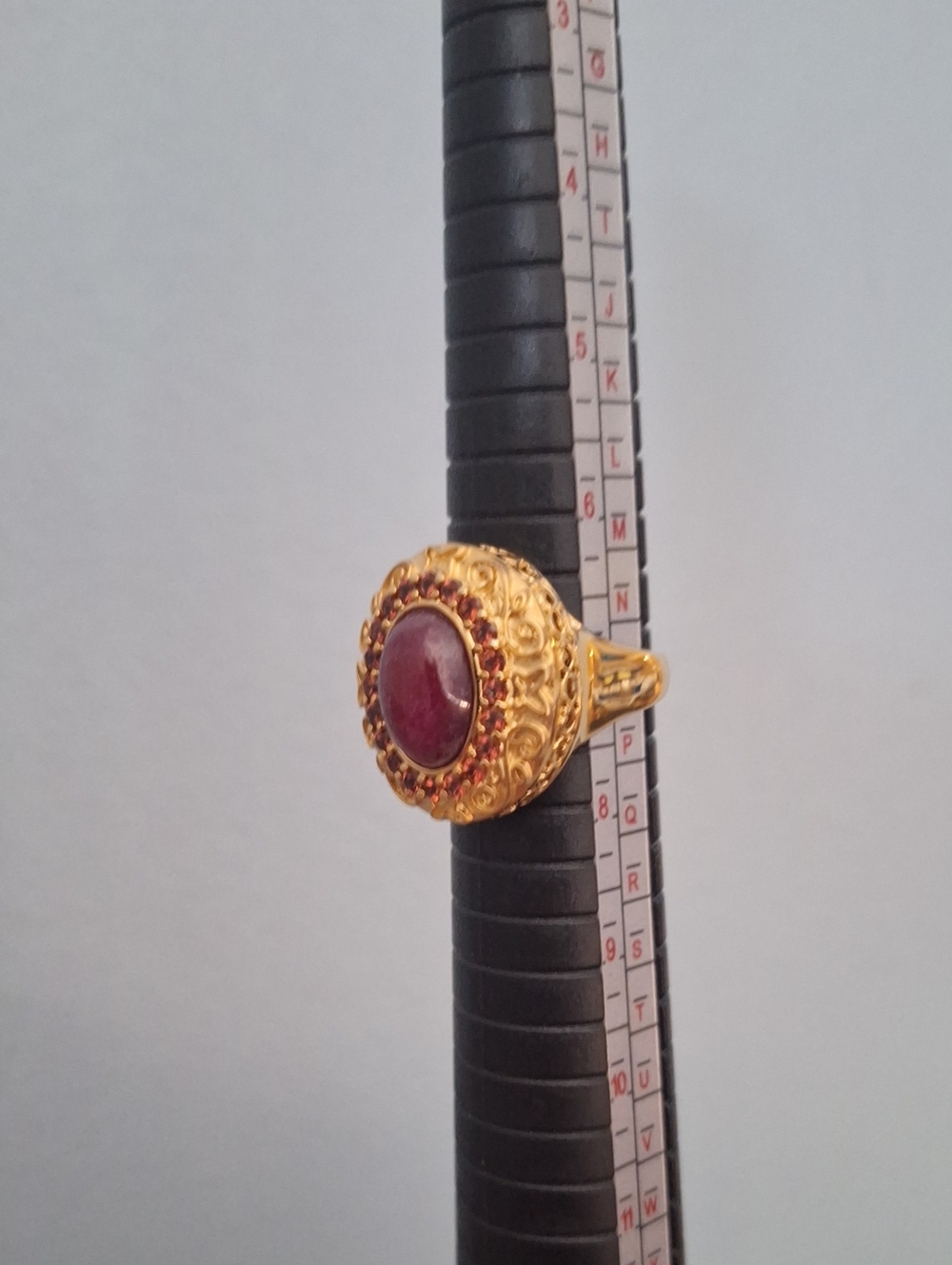 Gold-Tone Ring with Deep Red Cabochon and Accent Stones